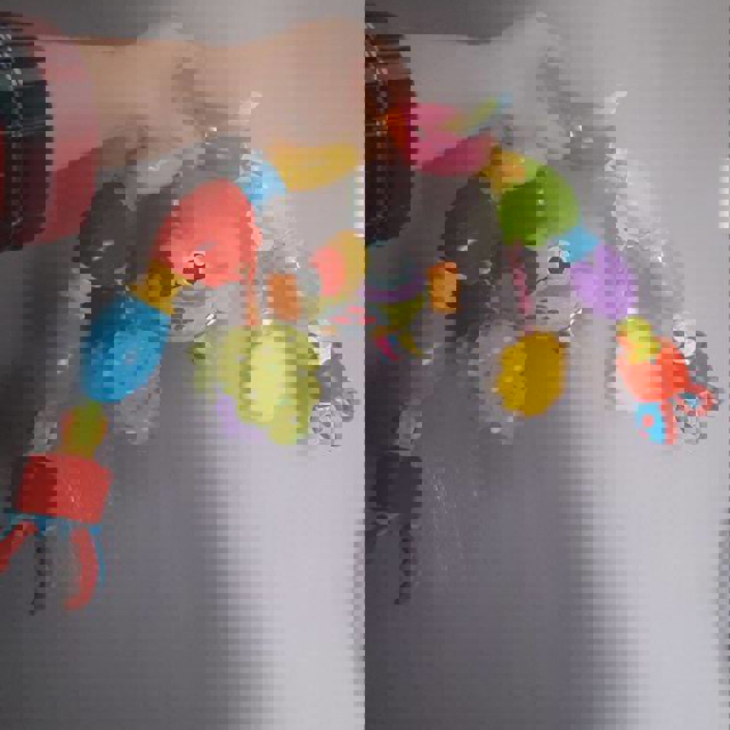 Дуга на коляску с подвесными игрушками