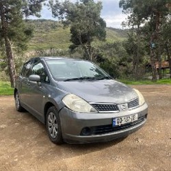 Nissan Tiida - фото 2