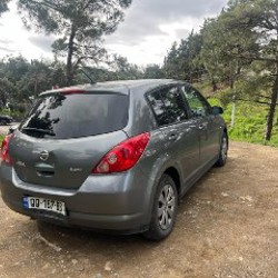Nissan Tiida - фото 4
